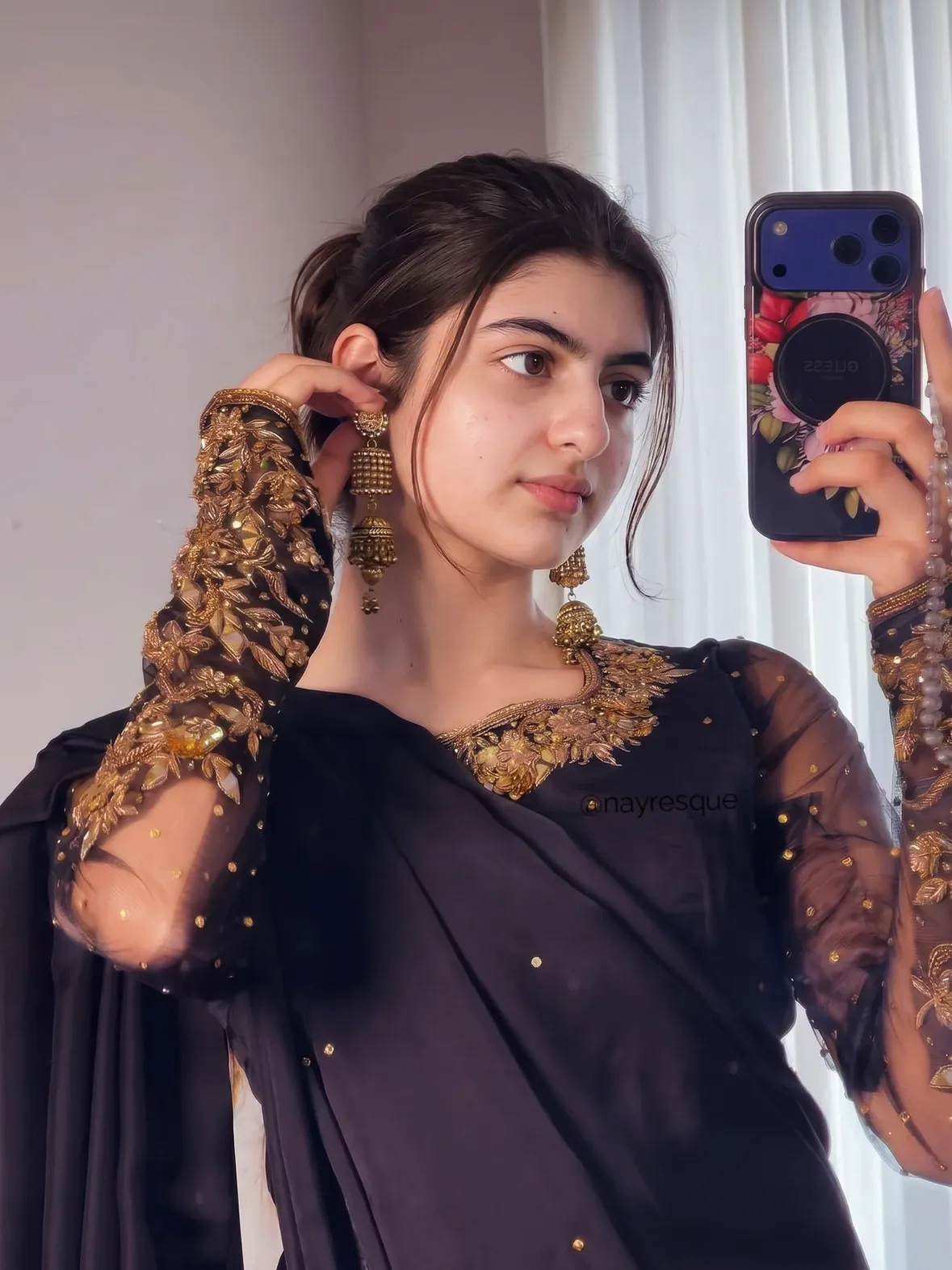 black and gold might be the prettiest love language ✨

some outfits don’t need a big moment to feel special.
just soft light, a pair of jhumkas, and that one look that makes you pause in the mirror a little longer.

this one felt equal parts classic and effortless — the sheer embroidered sleeves, the gold detailing, the statement earrings, and that quiet kind of confidence traditional wear brings out.
not loud. not overdone. just elegant in the most timeless way.

sometimes the best looks aren’t the ones you plan too much… they’re the ones that instantly feel like you.

Which slide is your favorite — 1, 2, 3, or 4?
Save this for your next black ethnic outfit inspo moment 🖤✨
. 
.
.
.
#EthnicWear #BlackOutfitIdeas #DesiStyle #JhumkaLook #EmbroideredSuit