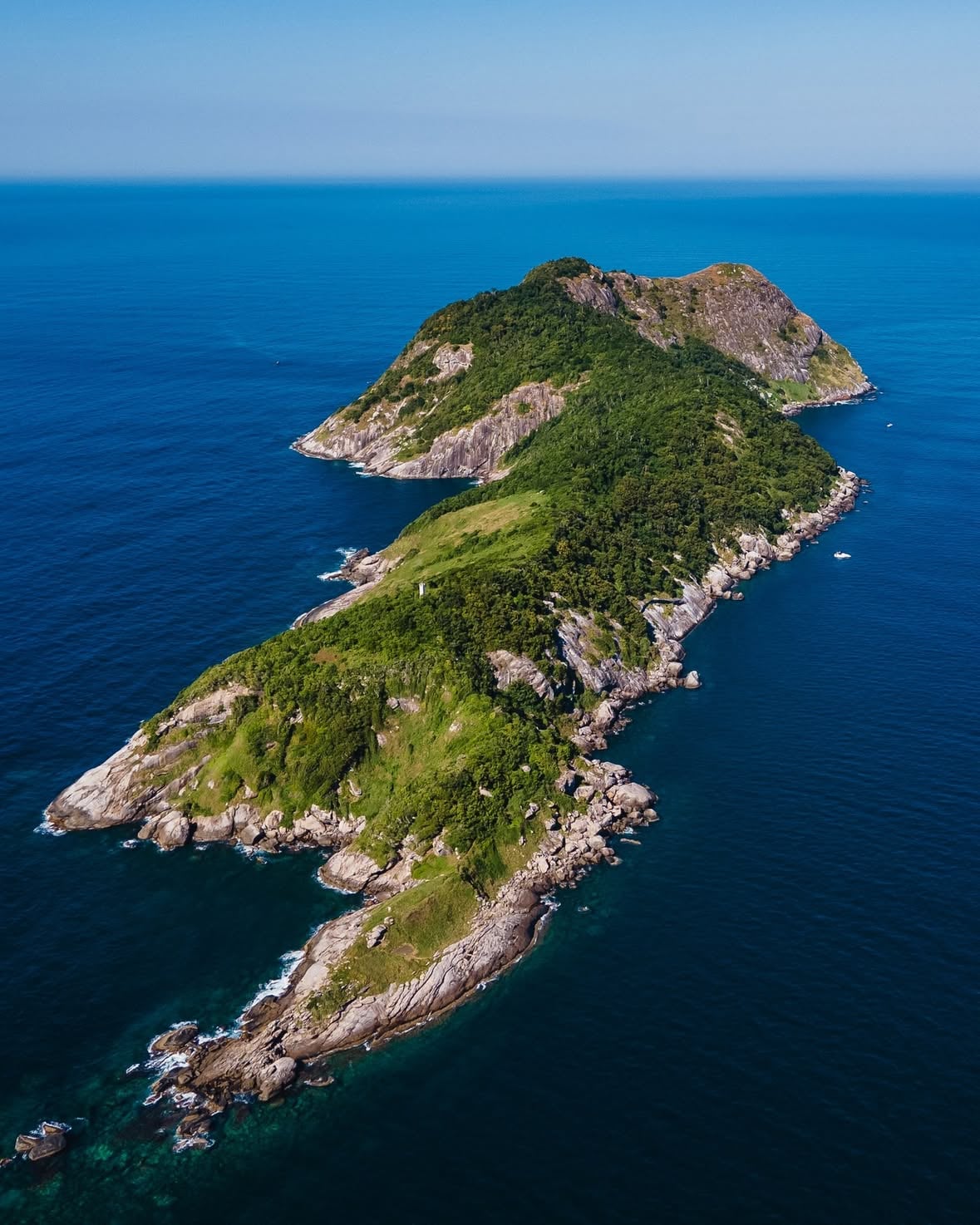 Photo by @nickschukkel | Standing just offshore from Ilha da Queimada Grande, also known as Snake Island, located on the southern coast of São Paulo State, Brazil, felt almost unreal. From above, its isolated cliffs, dense Atlantic forest, and the endless blue surrounding it created a scene that seemed straight out of a nature documentary or even a digital adventure game. In that moment, the line between reality and imagination felt thinner than ever.

Use #NatGeoYourShot for a chance to be featured!