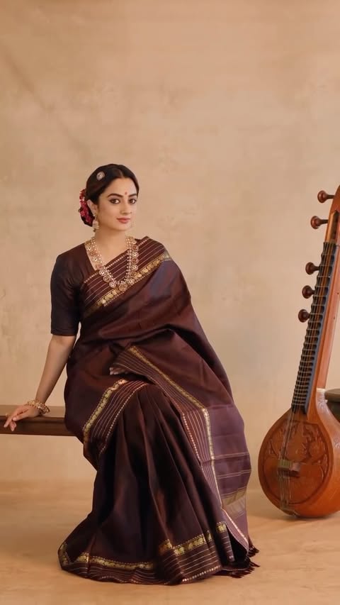 Coffee Brown Traditional Saree 🤎

A timeless Kanchipuram coffee brown saree woven with exquisite golden zari detailing, celebrating the beauty of heritage craftsmanship. The rich earthy tone is beautifully enhanced by delicate zari stripes across the body, while the elegant zari border and intricately woven pallu add a touch of regal charm.

Price- 20,850/-

Jewellery: @dcjewellers.official 
📷 : @studio.iksha 

#nammadesi #kanchipuramsaree