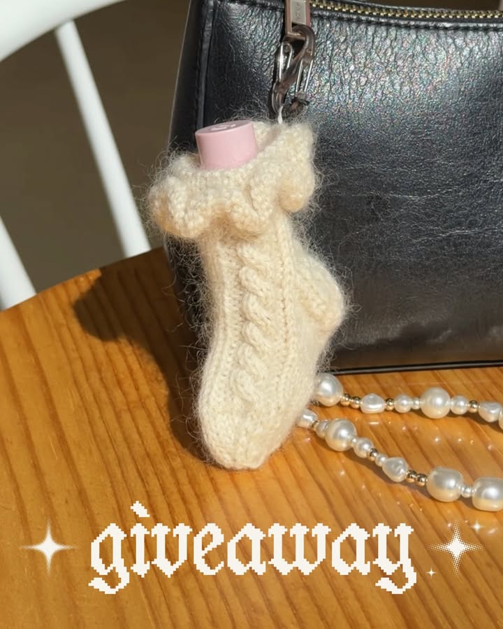 GIVEAWAY 🤍 the chilton charm pattern is officially on its way and will be coming out next week on tuesday, june 9th! to celebrate, i’m going to pick 3 people to get the pattern for free‼️ comment “ENTER” and i’ll send you the form to sign up. winners will be emailed on june 8th and the rest of you who enter will get a special discount as well 💌

this pattern is a mini version of my chilton socks pattern and i think it’s simply the most adorable thing! i was hesitant about making a pattern for it at first since i wasn’t sure if anyone would make it, but you all convinced me that enough of you liked the pattern to officially publish it 🥹 it’s such a cute way to use up fingering-weight (and mohair) scraps plus show off your love for knitting! as a heads up i actually would recommend knitting a pair of socks BEFORE tackling this charm as it’s even more finnicky than a normal sock pattern — however if you’re up for the challenge then go for it! excited to share more next week 🧦