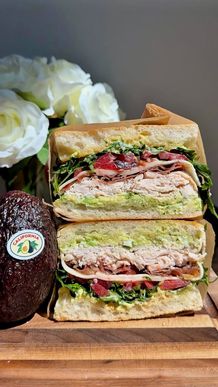 #AD Upgrade any sandwich with Basil & California Avocado Aioli made using @ca_avocados 🥑 We’re using it to make a club sandwich with turkey, crispy prosciutto, tomato, topped off with creamy, fresh slices of California Avocado. When picking up avocados for your sandwich, make sure to look for “California” on the label, to ensure your enjoying this delicious locally grown fruit.

BASIL & CALIFORNIA AVOCADO AIOLI:
¼ ripe, Fresh California Avocado
10 basil leaves
1 garlic clove
1/3 cup mayo
Squeeze of fresh lemon juice
Salt and pepper, to taste

SANDWICH
1 lightly toasted ciabatta roll
6-7 thin slices of turkey
5–6 slices of crispy prosciutto
2 slices of Muenster cheese
2 slices of heirloom tomatoes
Flaky sea salt
3-4 slices of ripe, Fresh California Avocado 
Handful of arugula
1 tbsp Dijon mustard

ARUGULA:
Handful of arugula
Drizzle of olive oil
Squeeze of fresh lemon juice
Salt and pepper, to taste

https://ff.recipes/turkey-ca-avocado-sandwich 

#feedfeed
